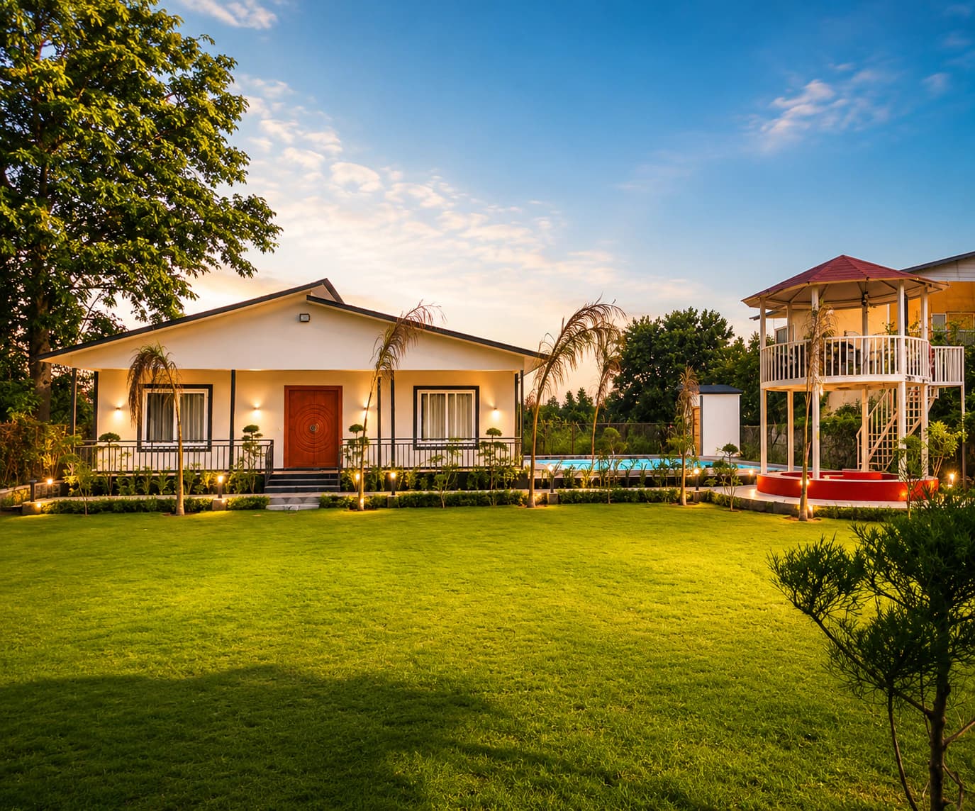 Silver Oak Estate at golden hour, with the residence, open private lawn, pool and garden gazebo
